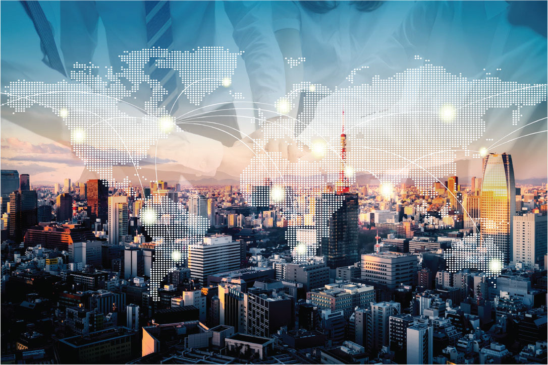 Image of modern high rises with world map overlay and people joining hands