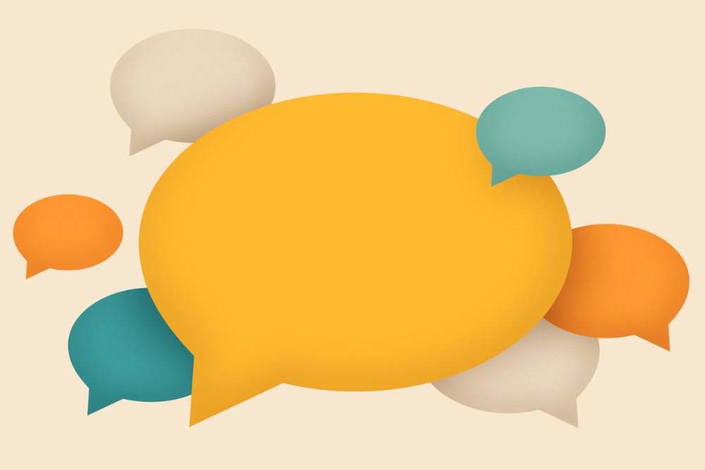 A large yellow speech bubble in the center, surrounded by smaller teal, orange, and beige bubbles on a light background, representing conversation.