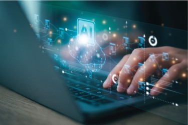 close-up of hands typing on a laptop